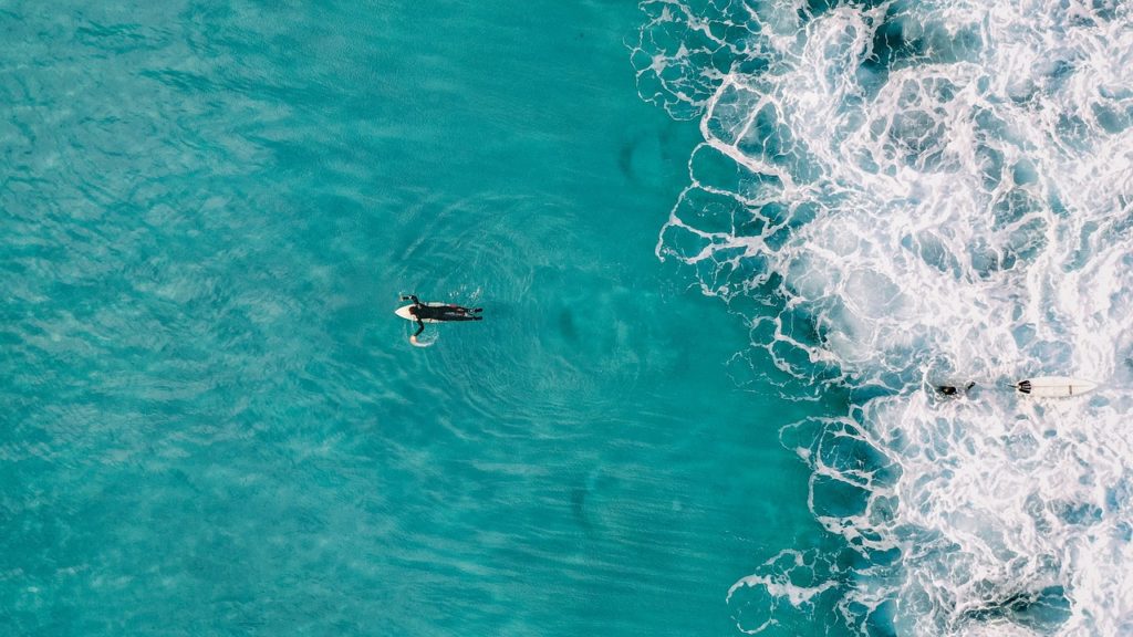 man surfing in the ocean as a rewarding hobby